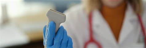 Ultrasonic machine sensor in hands of doctor therapist in clinic ...