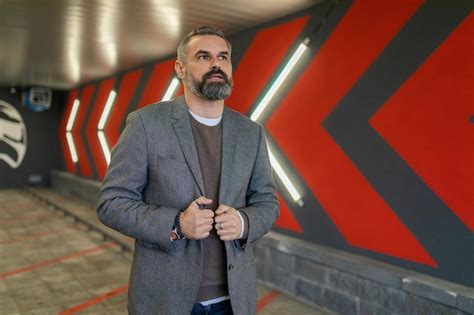 Man in a Business Suit in a Mall Parking Lot 的图像结果