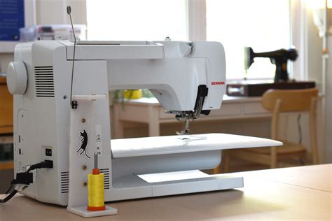 Image result for How to Use Large Thread Spool On Machine
