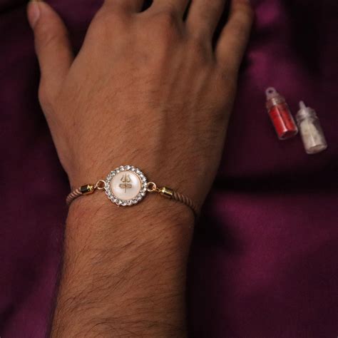 Trishul Charm Braclet Rakhi (Roli+Chawal) – The Advitya