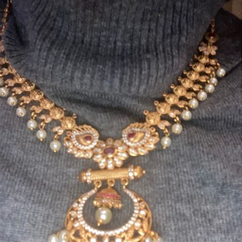 Buy Tarinika Anu Antique Gold Plated Short Necklace & Chandbali Earring ...