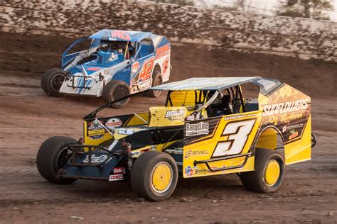 Download Three Dirt Track Racing Cars On A Dirt Track Wallpaper ...