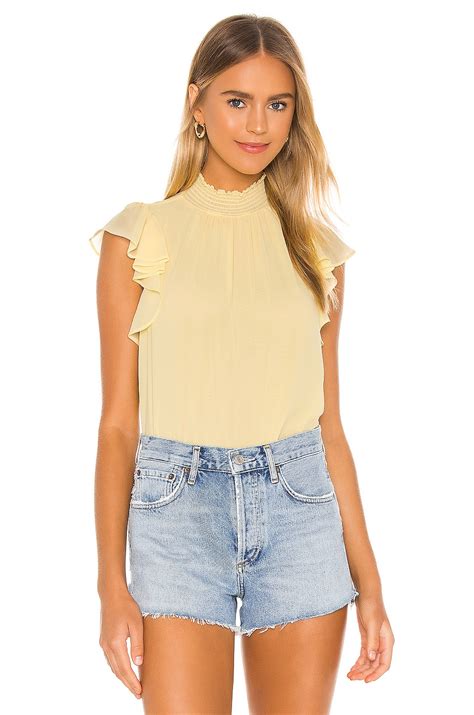 1. STATE Flutter Sleeve Smocked Neck Blouse in Pale Yellow | REVOLVE