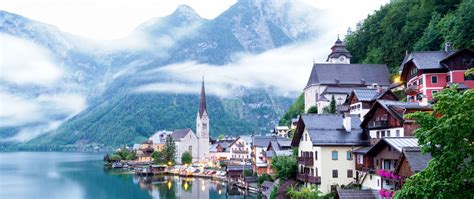 Download wallpaper 2560x1080 chapel, buildings, lake, mountains, clouds ...