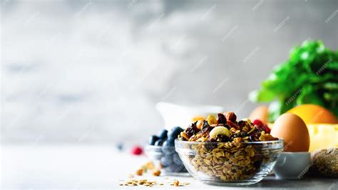 Premium Photo | Food background with gray texture and bowl healthy food