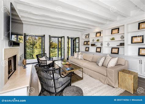 Living Room with a White Walls and Wood Floors Stock Photo - Image of ...