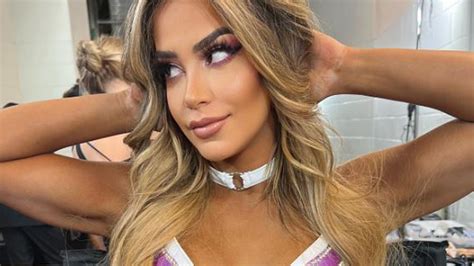 WWE stunner Aliyah stays busy by posting sexy bikini pics for legion of fans while nursing ...