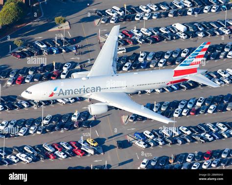 American Airlines Boeing 777 seen from above over international airport ...