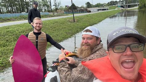 Viral video shows surfboarder's wild ride on flooded Arkansas ...