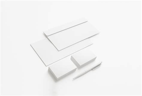 Blank envelopes and business cards isolated on white. | Free Photo