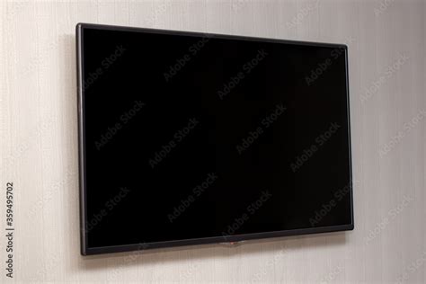 Large flat screen TV hanging on the wall, a TV with a black screen ...