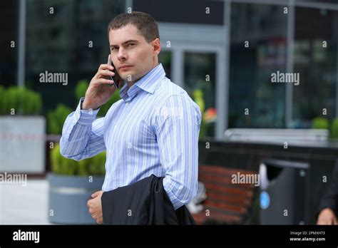 Man in a Business Suit in a Mall Parking Lot 的图像结果