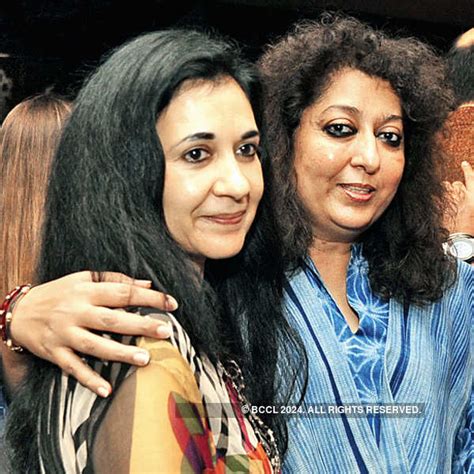 Carol Gracias walks the ramp with a girl from an NGO during a Pakistani ...