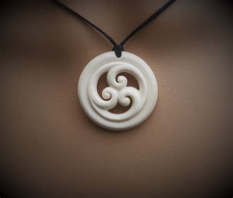 Maori koru trinity~ Handcarved in bone to symbolise Family unity & love ...