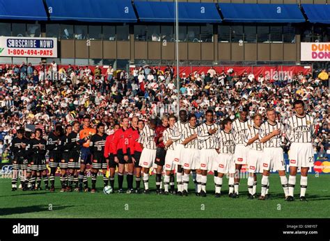 The two teams line up for the national anthem hi-res stock photography ...