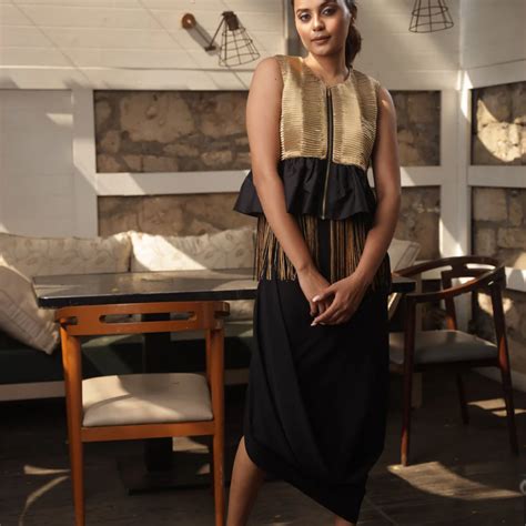 Gold tissue bolero jacket top with black and gold tassels. – ECHKE