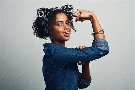 Girl portrait and happy with muscle in studio for women empowerment ...