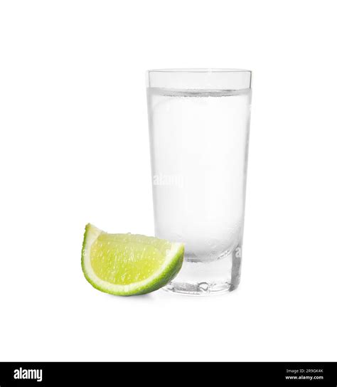 Shot of vodka with lime slice on white background Stock Photo - Alamy