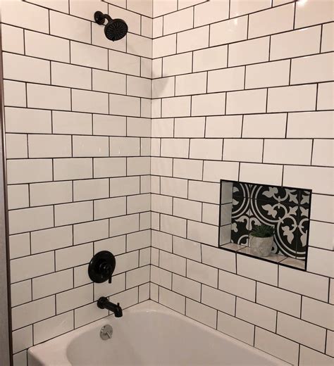 Elegant white subway tile with contrasting black grout