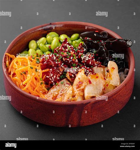 Hawaiian spicy chicken poke bowl with kimchi Stock Photo - Alamy