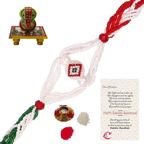 Designer Pearl Rakhi with Lord Ganesha on Marble Chowki and Roli Tikka ...