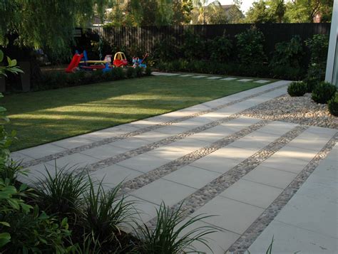 Eco Outdoor Eggshell pebbles laid in situ between concrete pavers. Eco ...