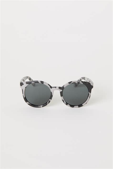 Polarised sunglasses - Dark beige/Leopard print - Kids | H&M IN