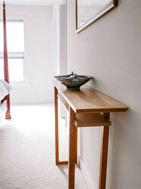 A narrow vanity table handmade from tiger maple and cherry - a ...