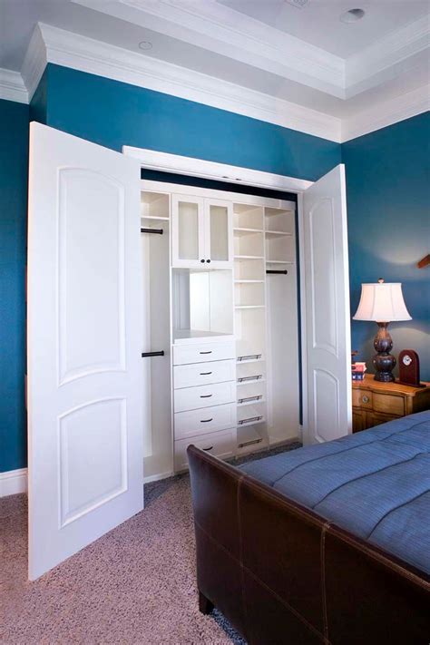 This bright and cheery reach-in closet provides wonderful storage ...