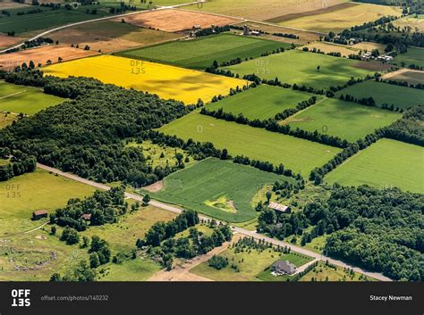 An aerial view of rectangular tracts of farmland stock photo - OFFSET