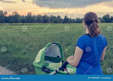 Active Mom Pushing a Stroller at Sunset. Stock Image - Image of jogging ...