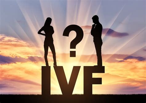 Thoughtful man and woman standing on the word ivf think of in vitro ...