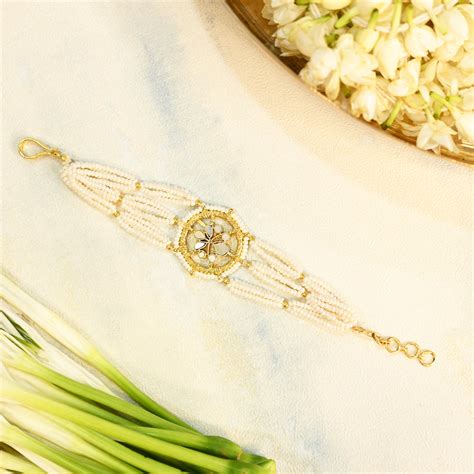 SJRB1014- White Colour Gold Plated Mother of Pearl Rakhi