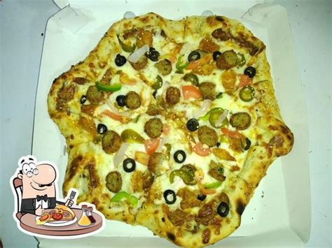 FAMOUS PIZZA (ZUBAIR BHAI), Thane, shop no 10 gurukripa apt opp mumbra ...