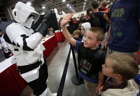 Families introduce kids to Comic Con culture while defending against ...