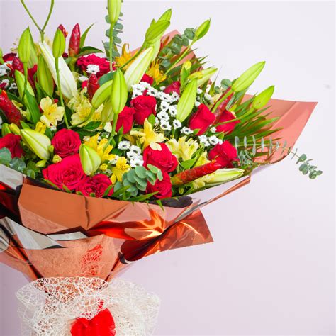 Buy Crimson Charm Flower Bouquet In Rose Gold Paper