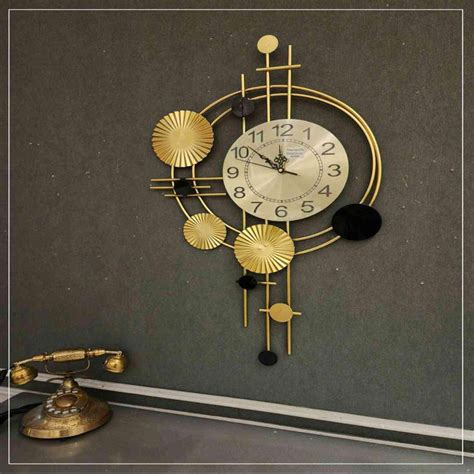 BLACK & GOLDEN METAL WALL CLOCK – SUREKH DECOR