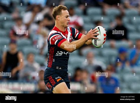 Daly Cherry-Evans of the Roosters warms up after the suspension in play ...
