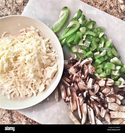 Chopped bell pepper, mushrooms and shredded cheese Stock Photo - Alamy
