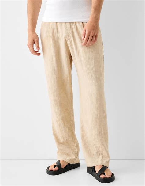 Textured rustic wide-leg trousers - Men | Bershka