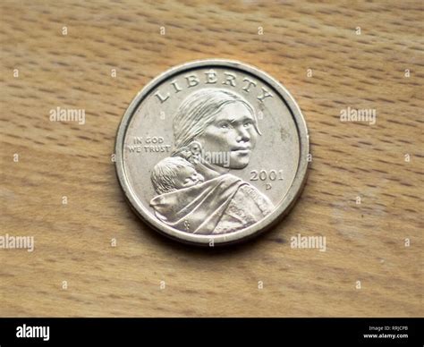 A Sacagawea dollar (also known as the "golden dollar"), a United States ...
