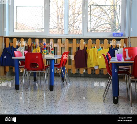 classroom in kindergarten with red small chairs and tables Stock Photo ...