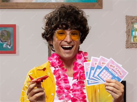 Front view smiley man holding lottery tickets | Free Photo