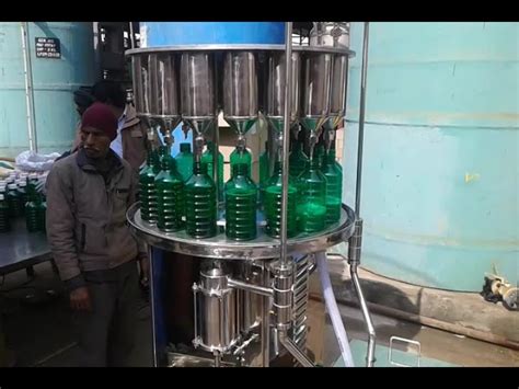 Liquid Bottle Filling Machine - Manual Six Head Liquid Filling Machine ...