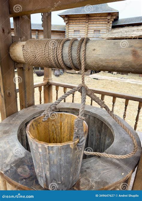 A Rusty Bucket with a Rope Hanging from it Stock Image - Image of ...