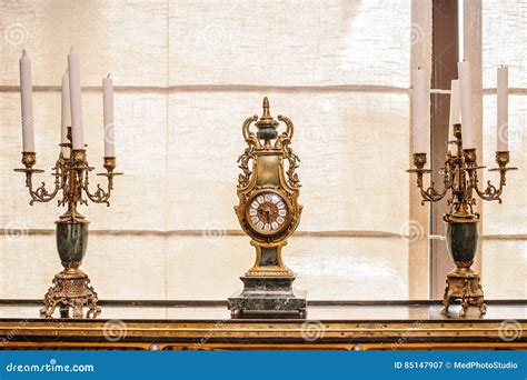 Antique clock and candles stock image. Image of analog - 85147907