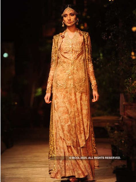 A model showcases a creation by designer Sabyasachi on Day 1 of Delhi ...