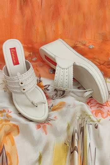 Buy Beige Cut Work Kolhapuri Wedges by Essemm Online at Aza Fashions.