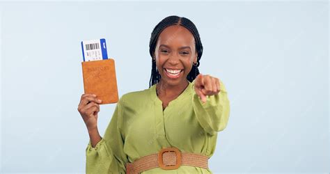 Premium Photo | African woman passport and studio portrait to point at you for airplane ticket ...