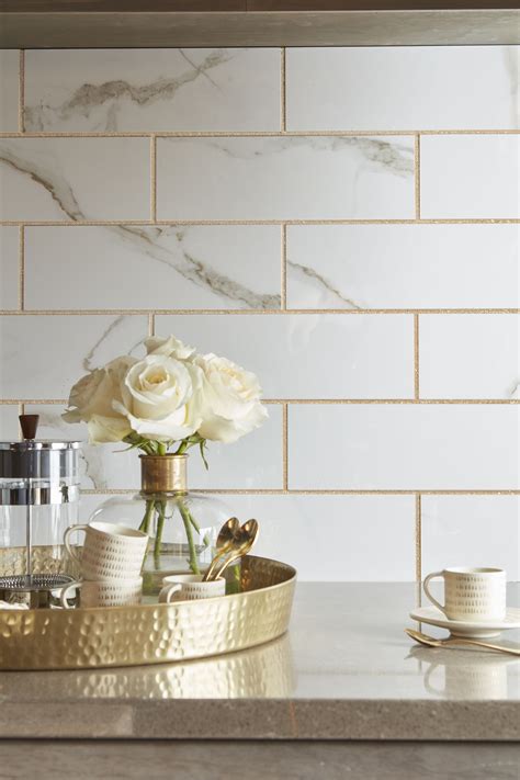 Gold accents. | Gold tiles kitchen, Gold tile, Kitchen backsplash designs